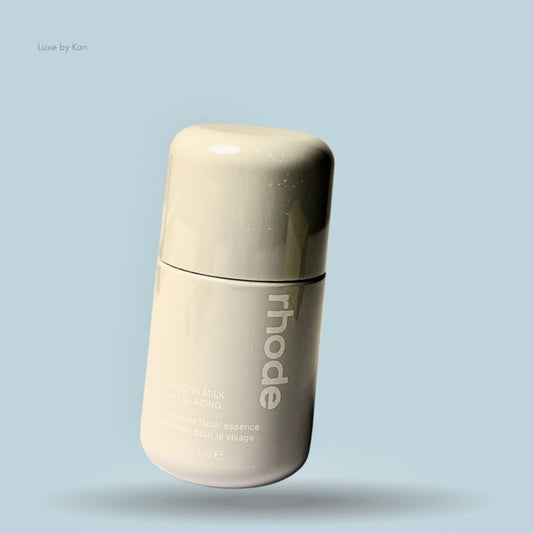Rhode Glazing Milk bottle with the "rhode" logo vertically aligned on the bottle.