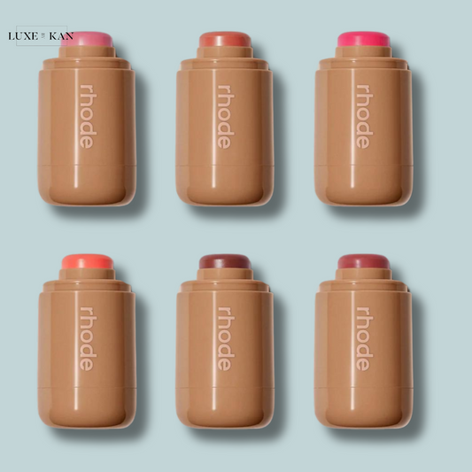 Six cylindrical rhode skin pocket blush cosmetics containers in various shades.