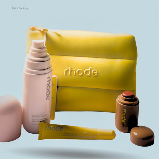 Rhode Summer Kit featuring a yellow cosmetics bag, glazing mist, peptide lip treatment, and a peptide lip tint.