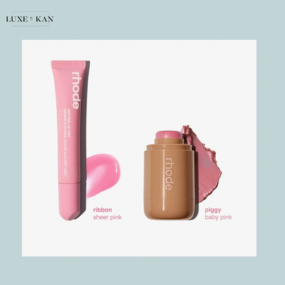 Two pink cosmetic products from Rhode: a sheer pink lip tint (Ribbon) and a baby pink stick (Piggy) with swatches beside them.