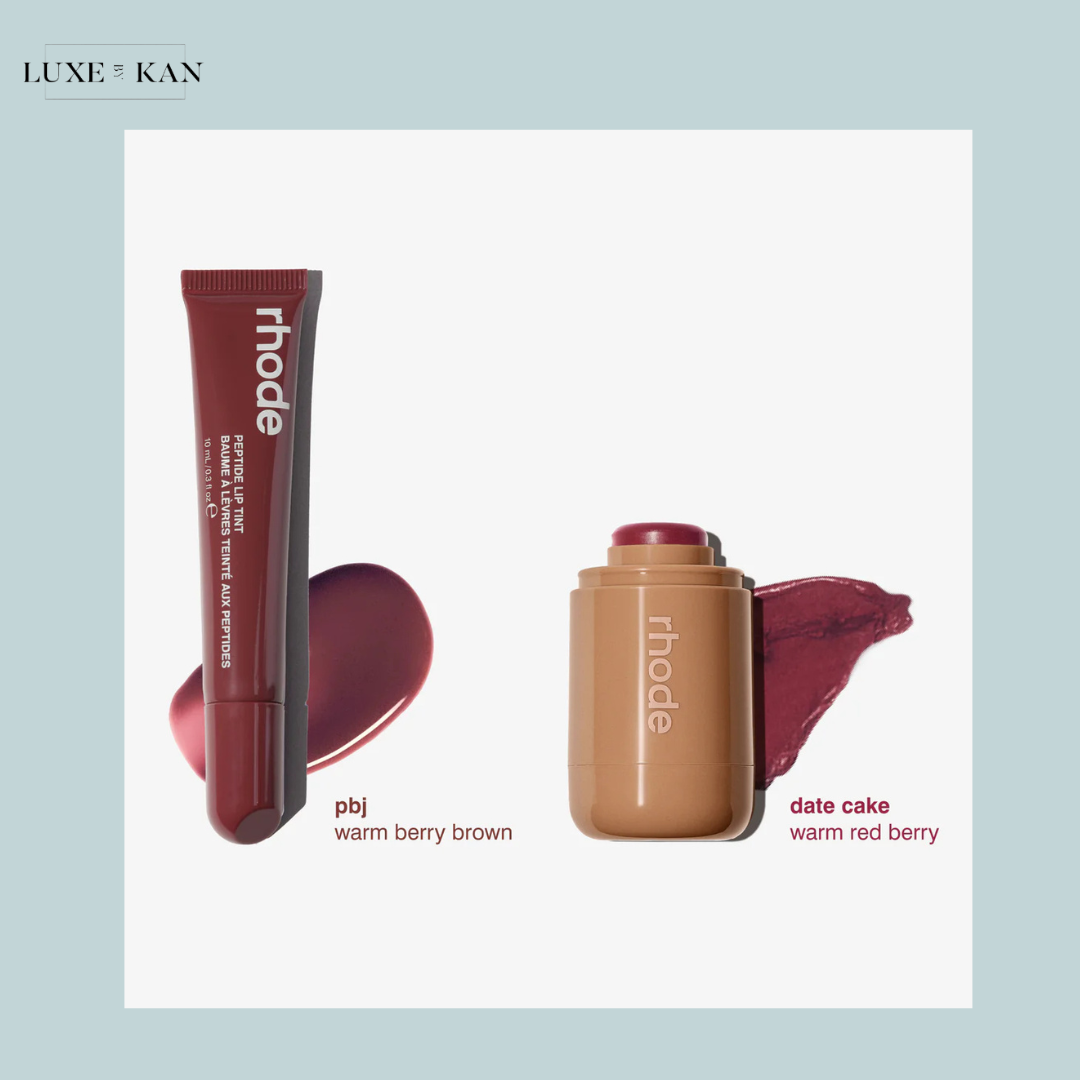 A rhode lip tint in "pbj," a warm berry brown, and a stick in "date cake," a warm red berry, displayed on a pastel background.