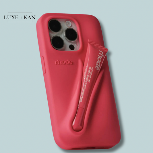 A vibrant pink Rhode Phone Summer Lip Case with a built-in holder for a Rhode lip tint, blending style and functionality.