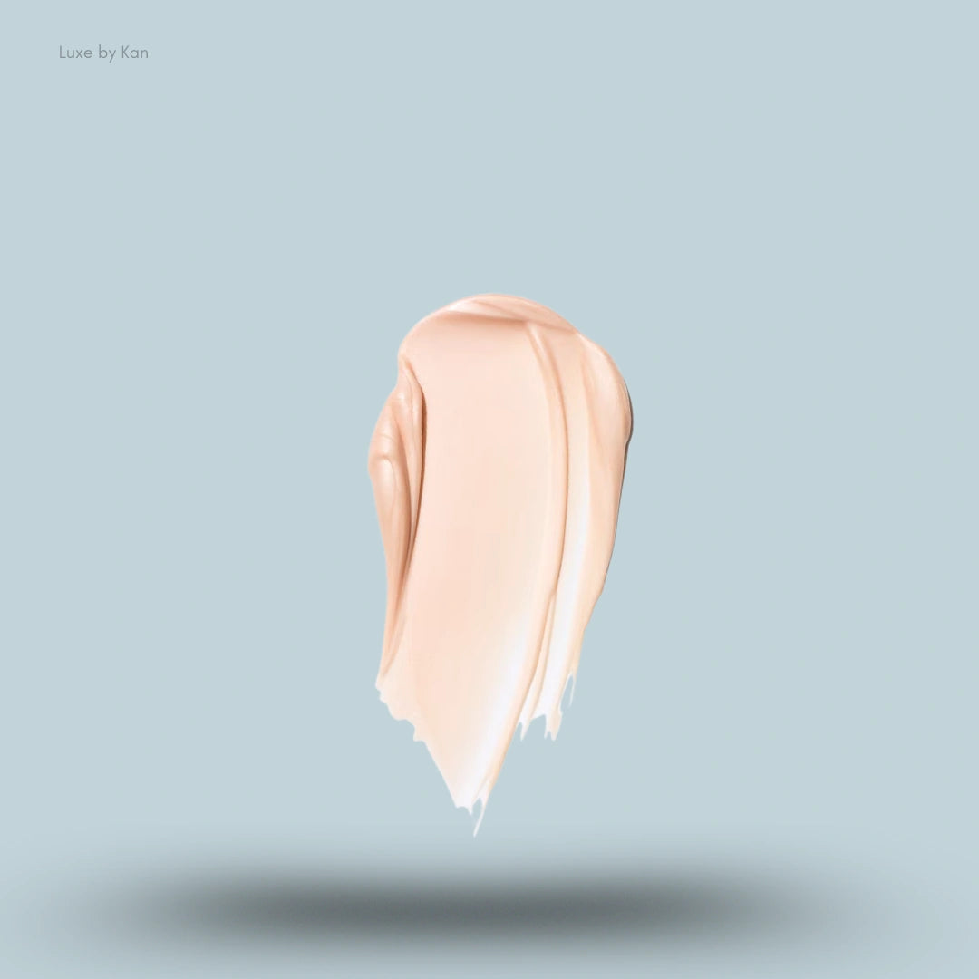 A thick swatch of a light peach-toned SAIE Glowy Super Gel or foundation product.