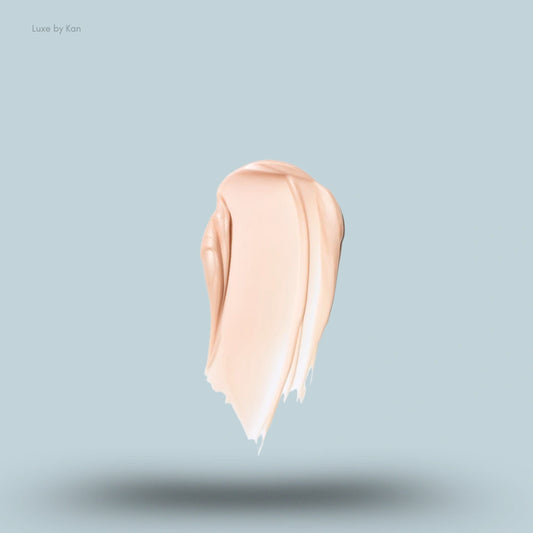 A thick swatch of a light peach-toned SAIE Glowy Super Gel or foundation product.