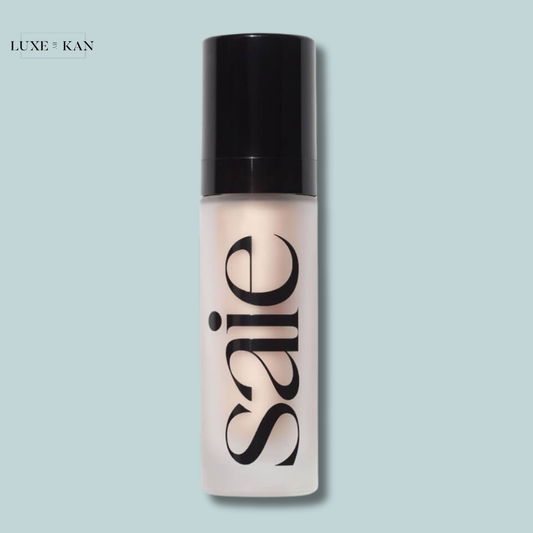 A translucent bottle of Saie Glowy Super Gel skincare product, featuring a black pump cap.