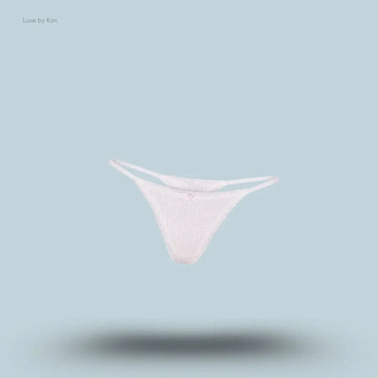 SKIMS Lightweight Cotton Pointelle Lace String Thong in Snow Peony Pin Dot, flat lay on light blue background