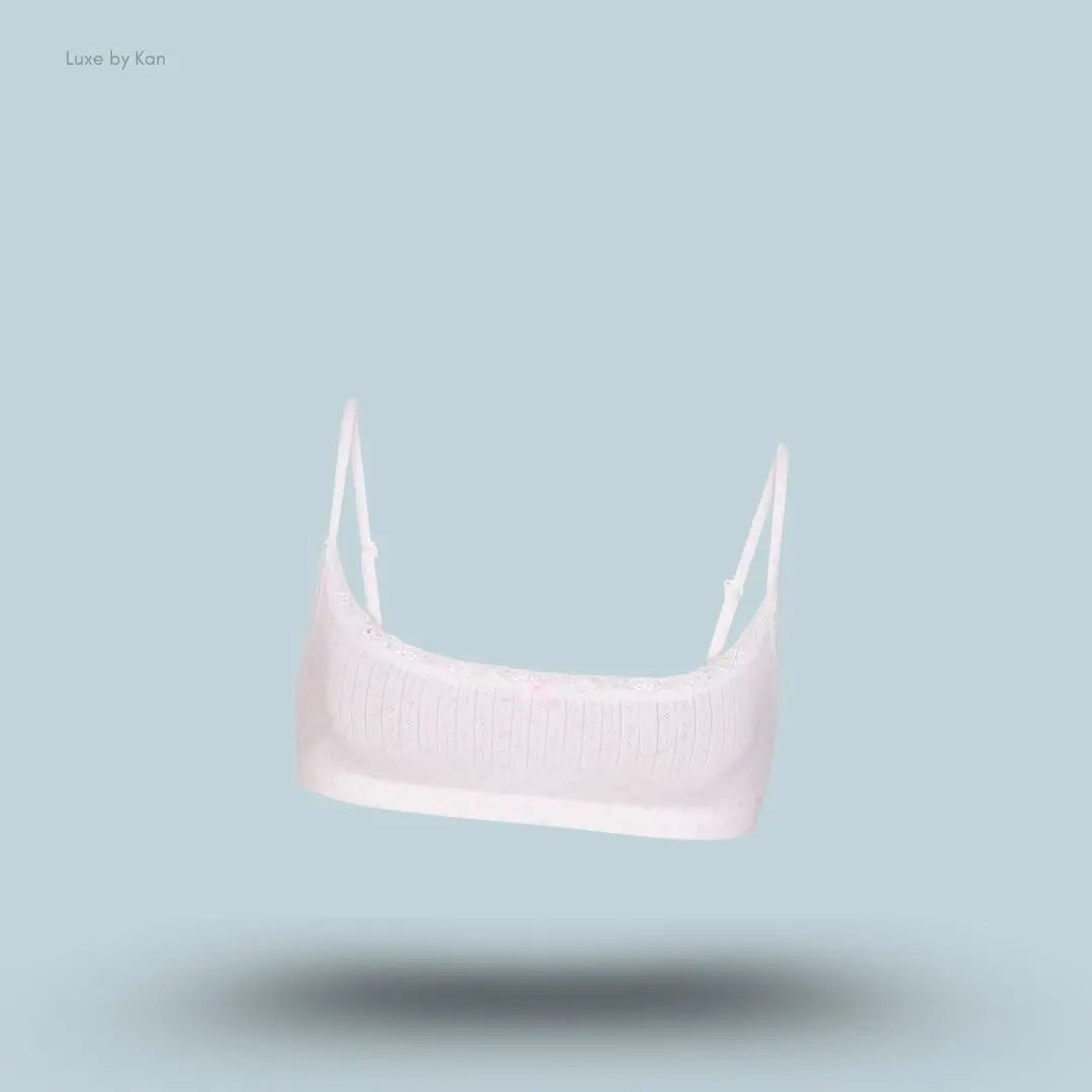 SKIMS Lightweight Cotton Pointelle Scoop Bralette in Snow Peony Pin Dot, flat lay on light blue background