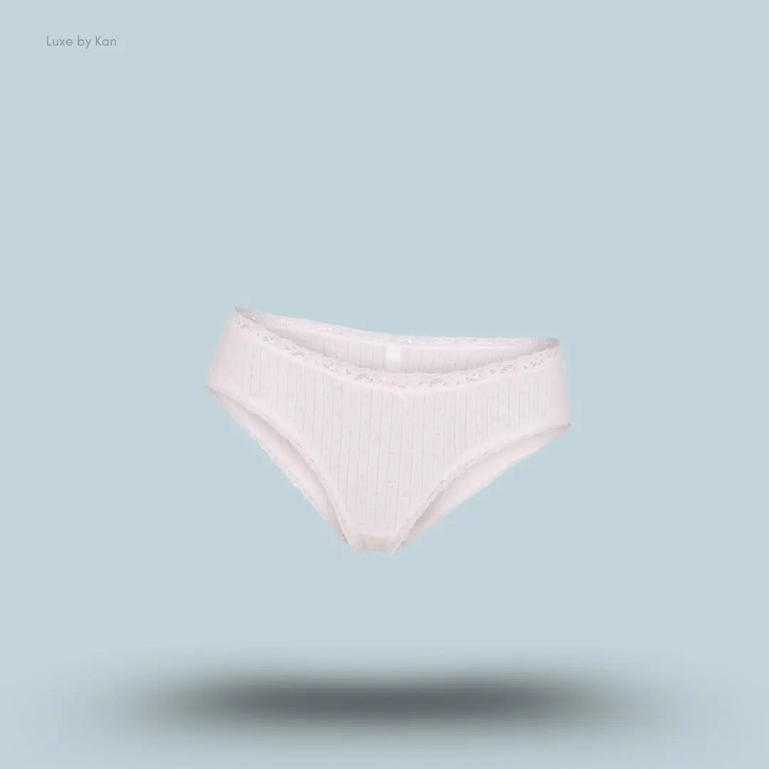 SKIMS Lightweight Cotton Pointelle Lace Brief in Snow Peony Pin Dot, flat lay on light blue background
