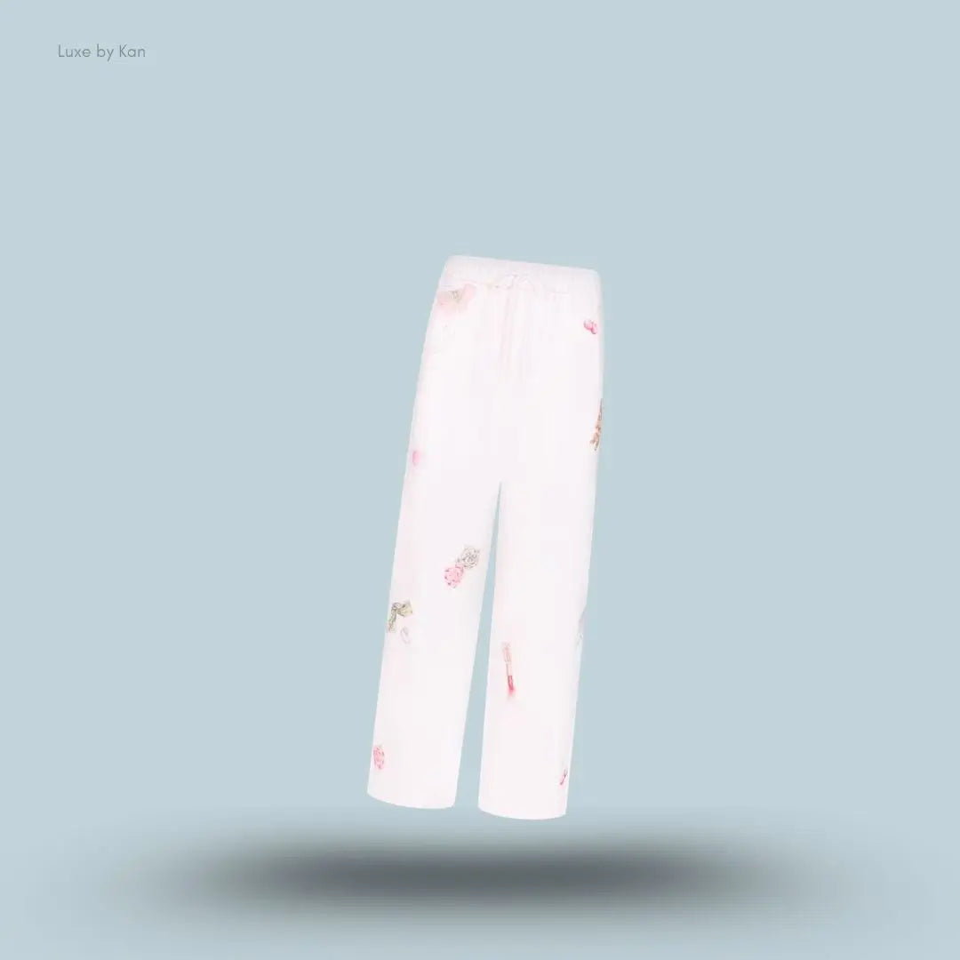 SKIMS Cotton Fleece Classic Straight Leg Pant in Snow Essentials, flat lay on light blue background