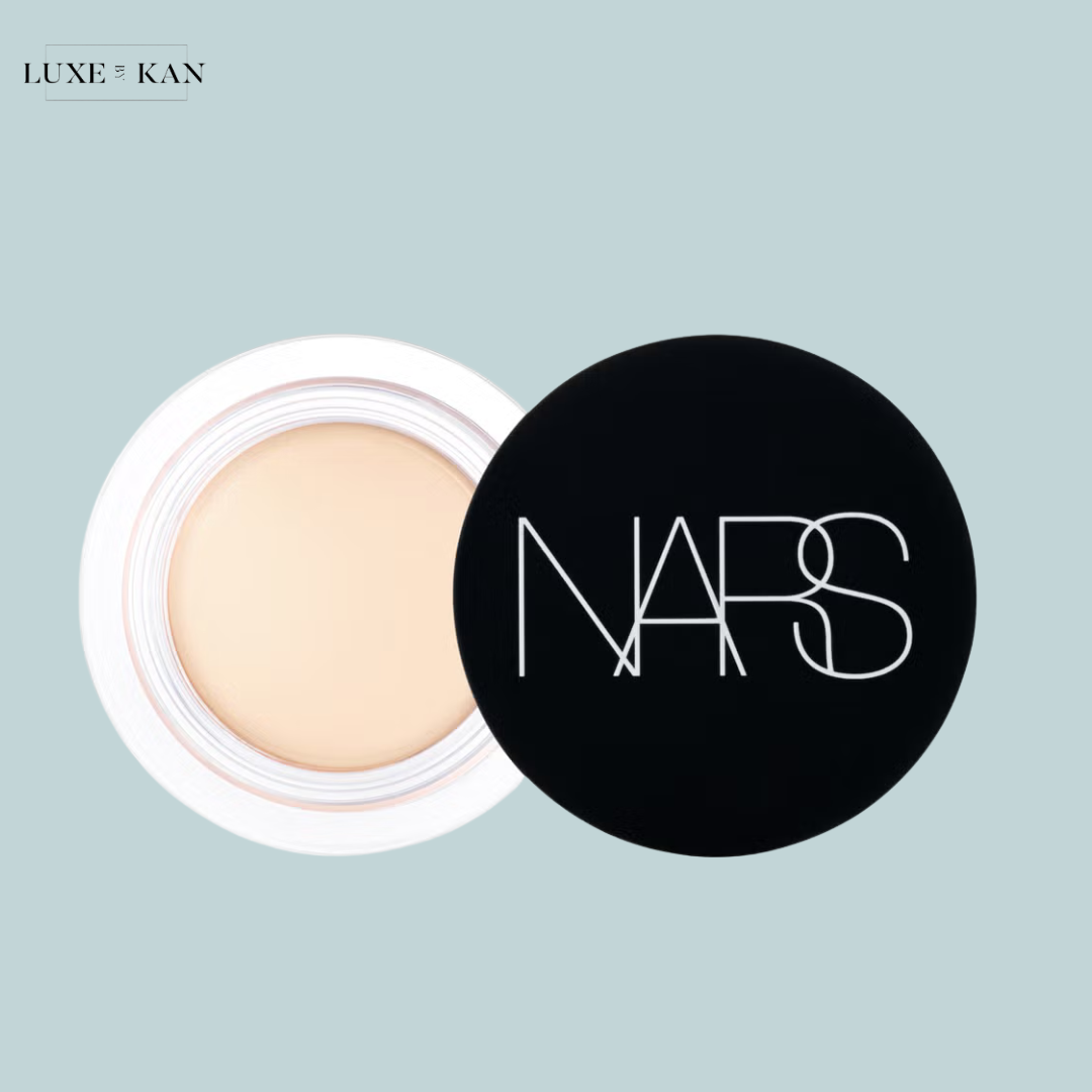 NARS matte cream concealer in a sleek black container, placed open to showcase the smooth, light beige formula inside.