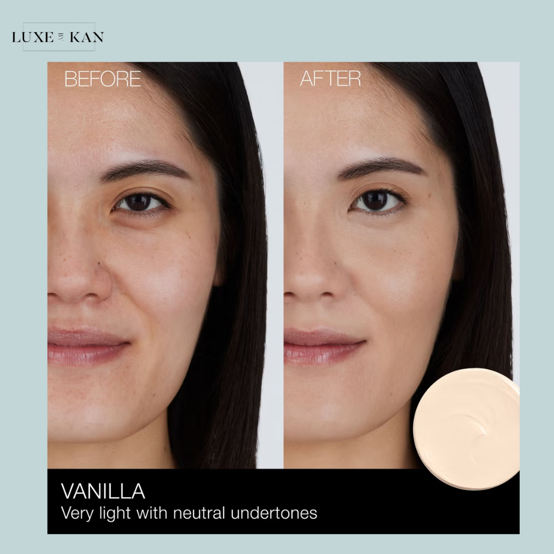 A close-up of a skin tone foundation labeled "Vanilla," shown next to a creamy swatch, on a light blue background.