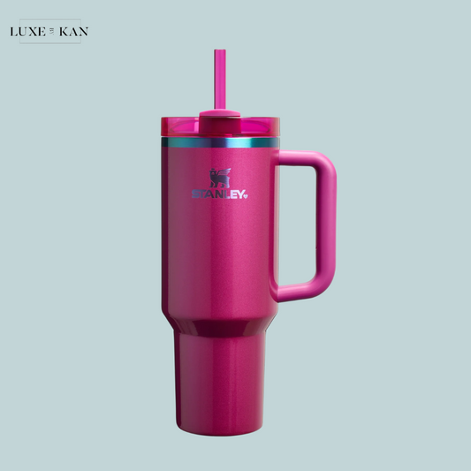 Stanley Valentine's Day Quencher H2.0 Flowstate™ Tumbler in bright pink with handle and straw against a light blue background.