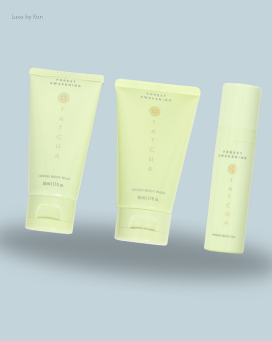 Tatcha forest awakening skincare products set: Hinoki Body Milk, Hinoki Body Wash, and Hinoki Body Oil.