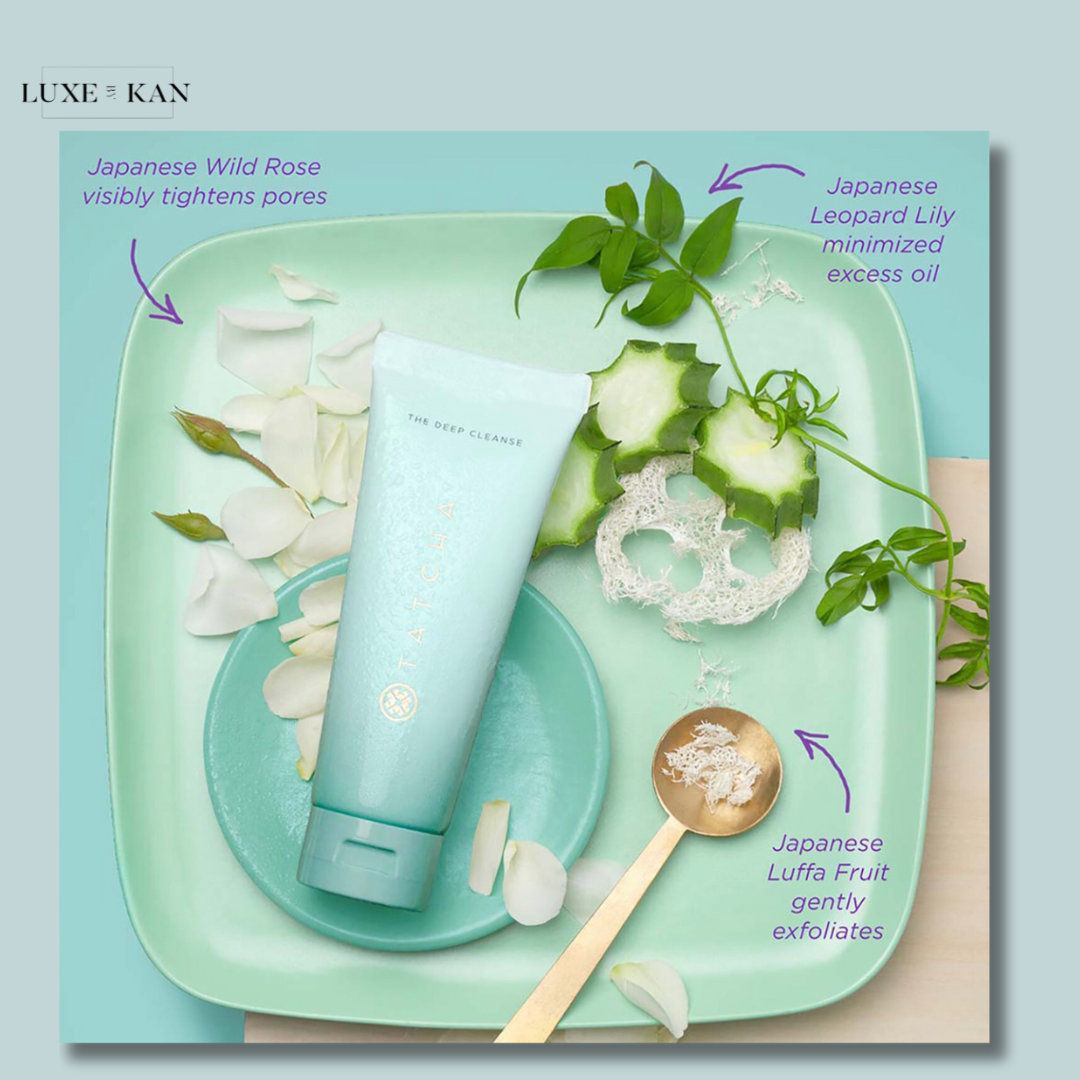 A calming turquoise display featuring Tatcha's The Deep Cleanse, surrounded by Japanese ingredients like Wild Rose, Leopard Lily, and Luffa Fruit.