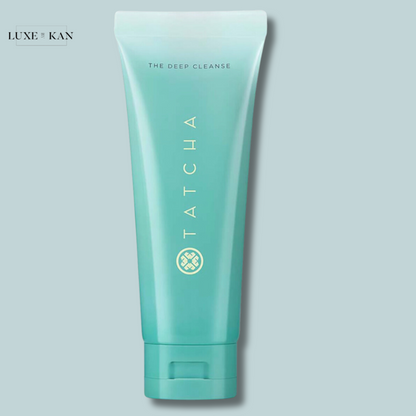 A tube of Tatcha's "The Deep Cleanse" facial cleanser, featuring a light blue design with gold text and a logo.