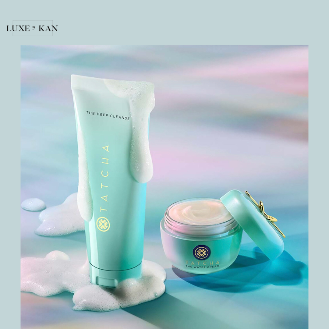 Tatcha skincare products on a pastel background: a foaming cleanser tube and a jar of hydrating cream, radiating freshness and elegance.