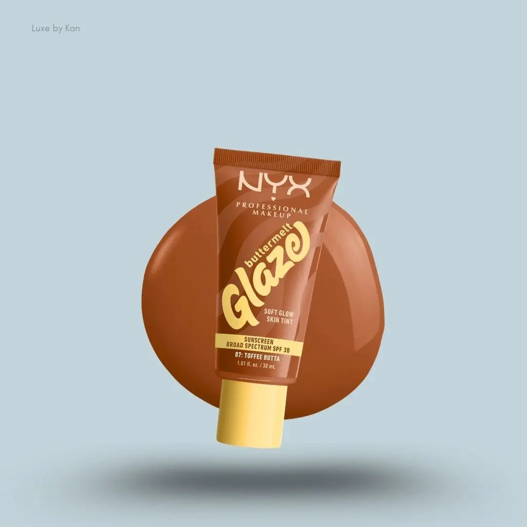 NYX Professional Makeup Buttermelt Glaze Skin Tint SPF 30 tube and swatch on blue background — LBK