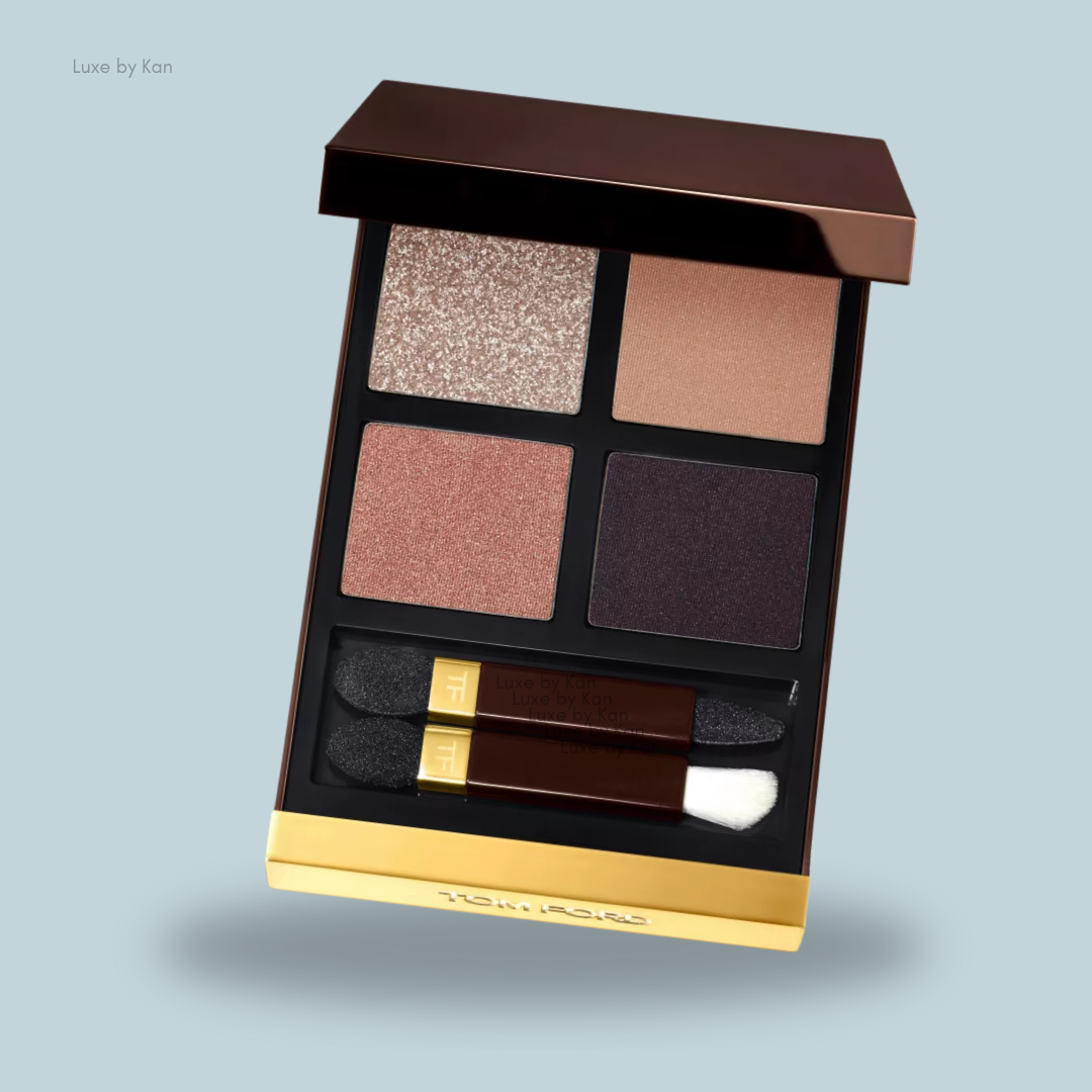A luxurious Tom Ford Eye Colour Quad palette featuring four shades: shimmering beige, soft pink, rich plum, and dark matte, with applicators included.