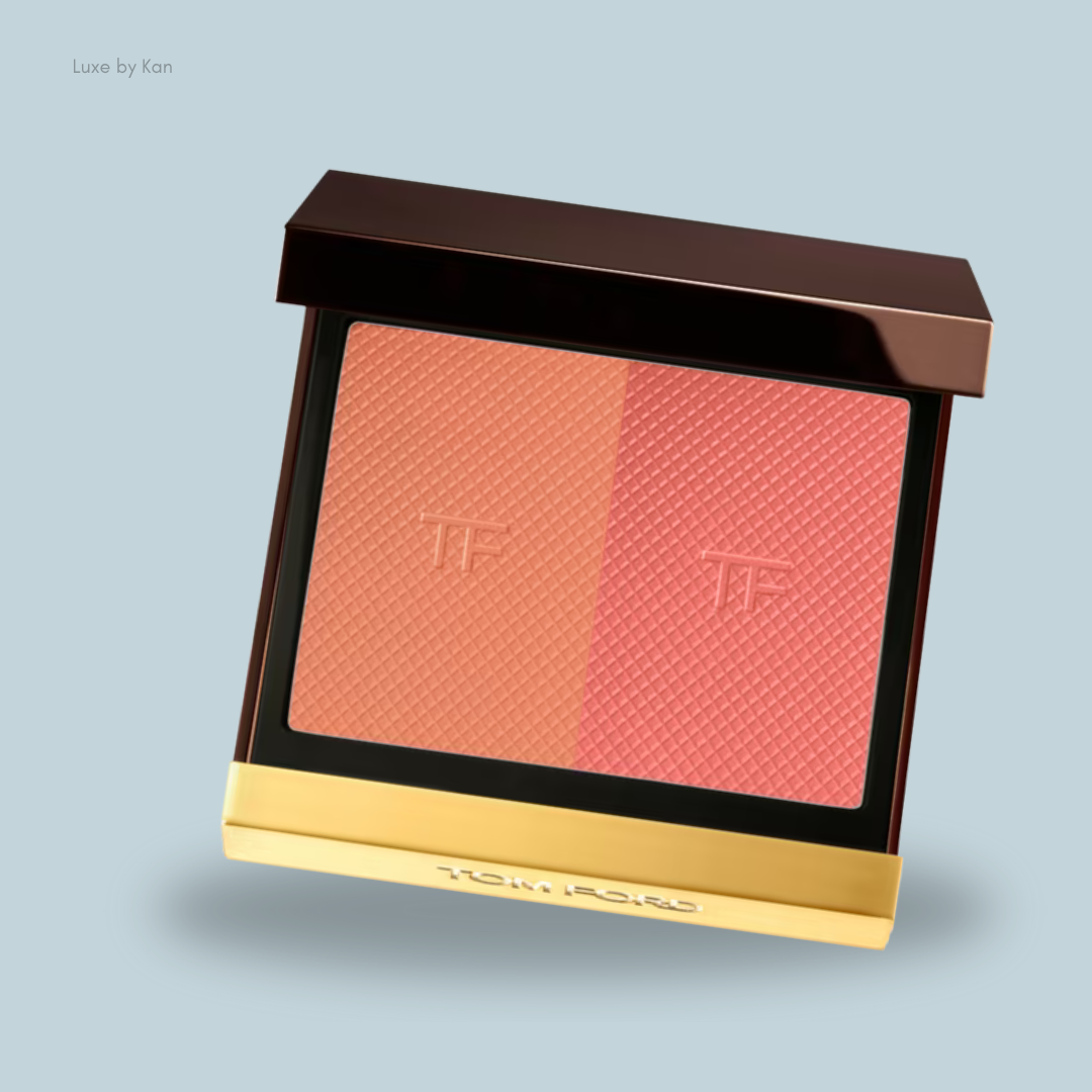 A Tom Ford dual-tone blush compact featuring peach and coral shades, with a sleek brown and gold design.