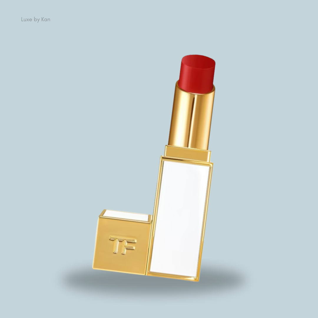 A stylish Tom Ford Ultra Shine Lip Colour lipstick tube with a red bullet, featuring a white panel and the "TF" logo.