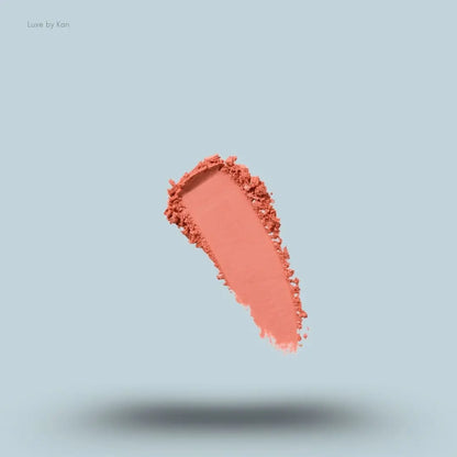 Kylie Cosmetics Pressed Blush Powder swatch on blue background — LBK India