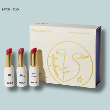 A trio of Bisou Balm Avec Amour Edition lipsticks.