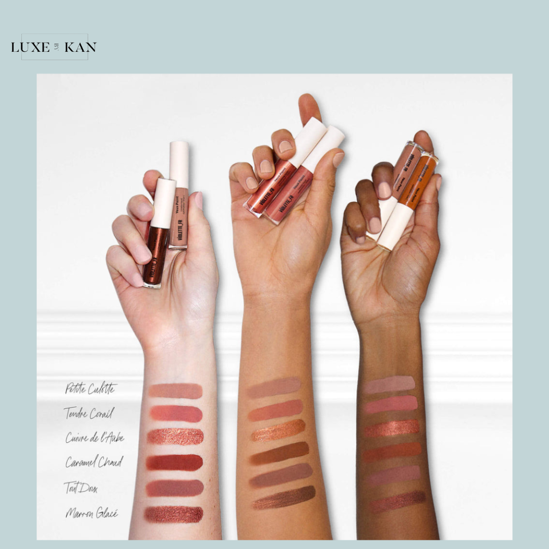 Three hands showcase various VIOLETTE FR liquid eyeshadow products, with swatches in shades from deep brown to soft pink.