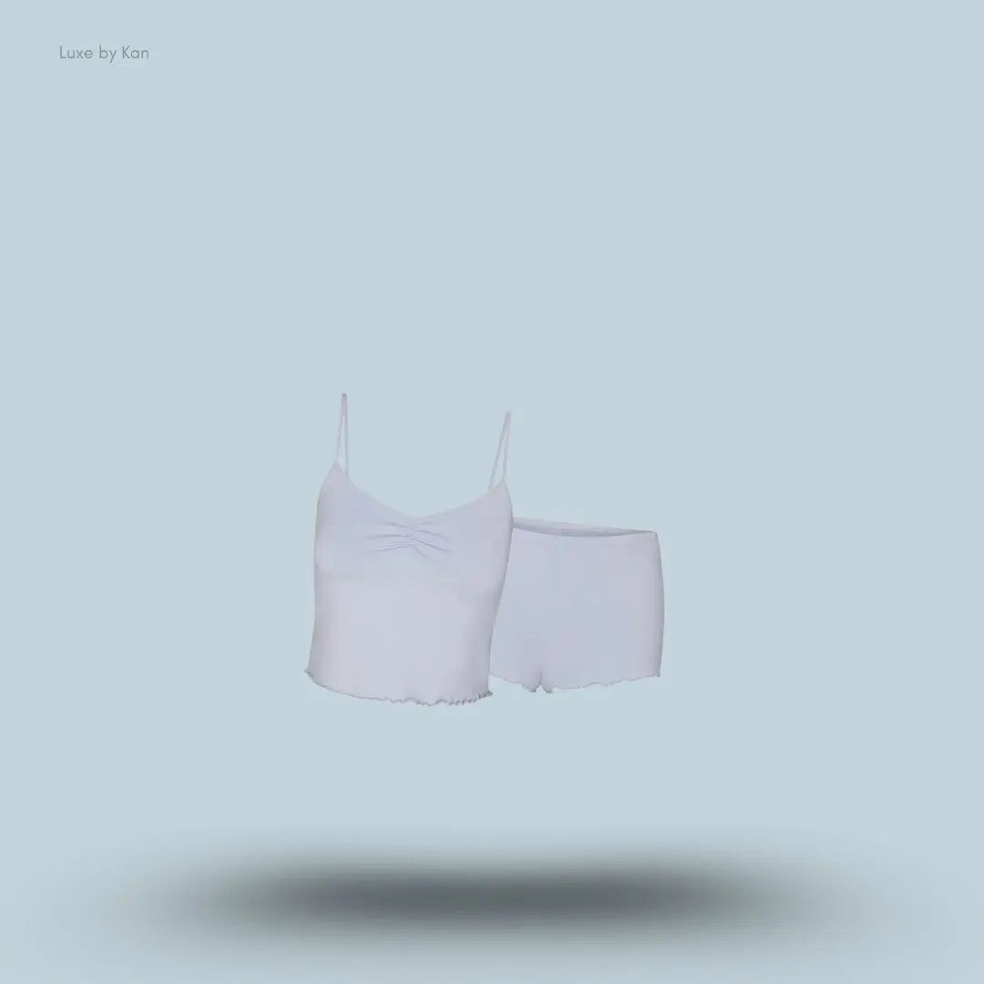 SKIMS Sleep Cami Set in Zen Blue, flat lay on light blue background