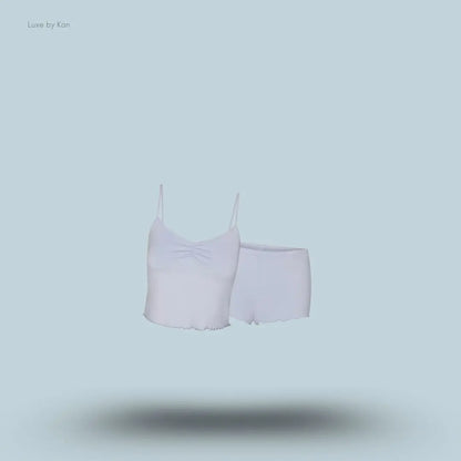 SKIMS Sleep Cami Set in Zen Blue, flat lay on light blue background