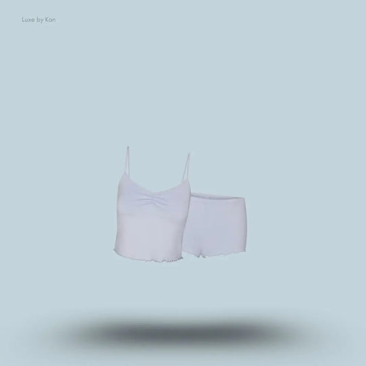 SKIMS Sleep Cami Set in Zen Blue, flat lay on light blue background