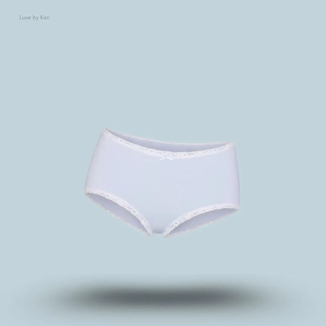 SKIMS Lightweight Cotton Lace Boy Short in Airspace, flat lay on light blue background