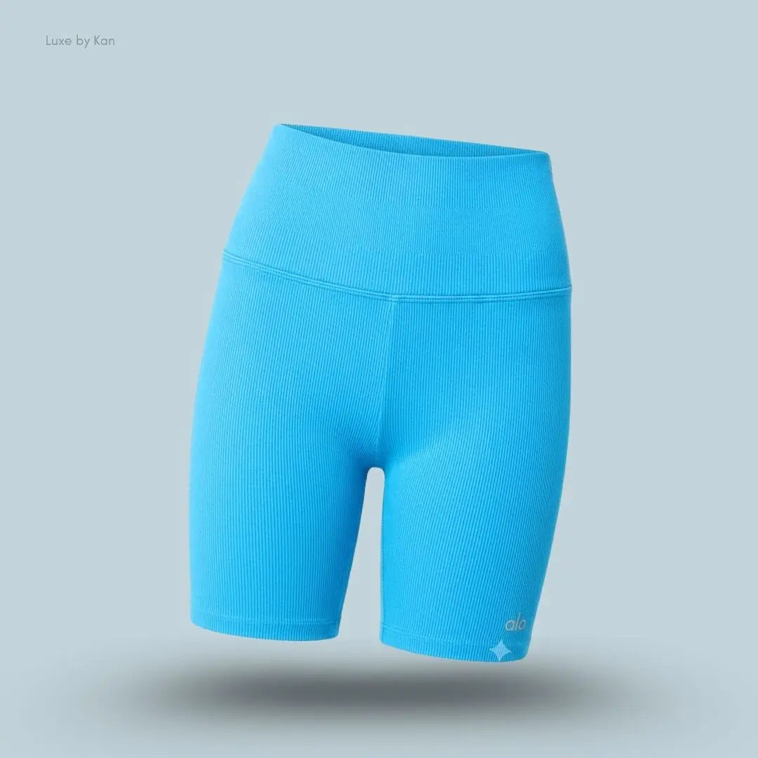 Alo 5 inch Seamless Ribbed Favorite Short in Azure Blue, flat lay on light blue background