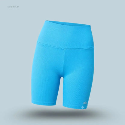 Alo 5 inch Seamless Ribbed Favorite Short in Azure Blue, flat lay on light blue background