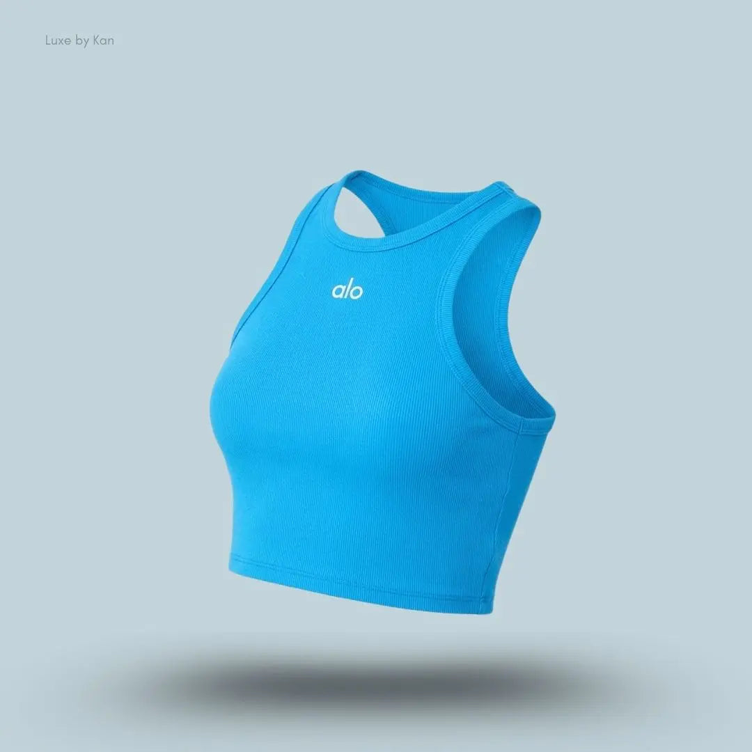 Alo Aspire Tank in Azure Blue/White, flat lay on light blue background