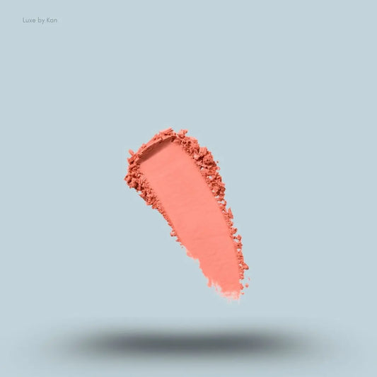 Kylie Cosmetics Pressed Blush Powder swatch on blue background — LBK India