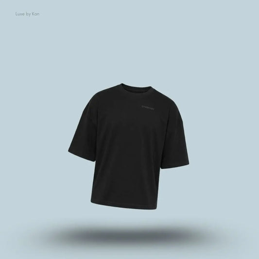 Gymshark Accent Boxy T-Shirt in black displayed on a blue background with an oversized boxy short-sleeve design