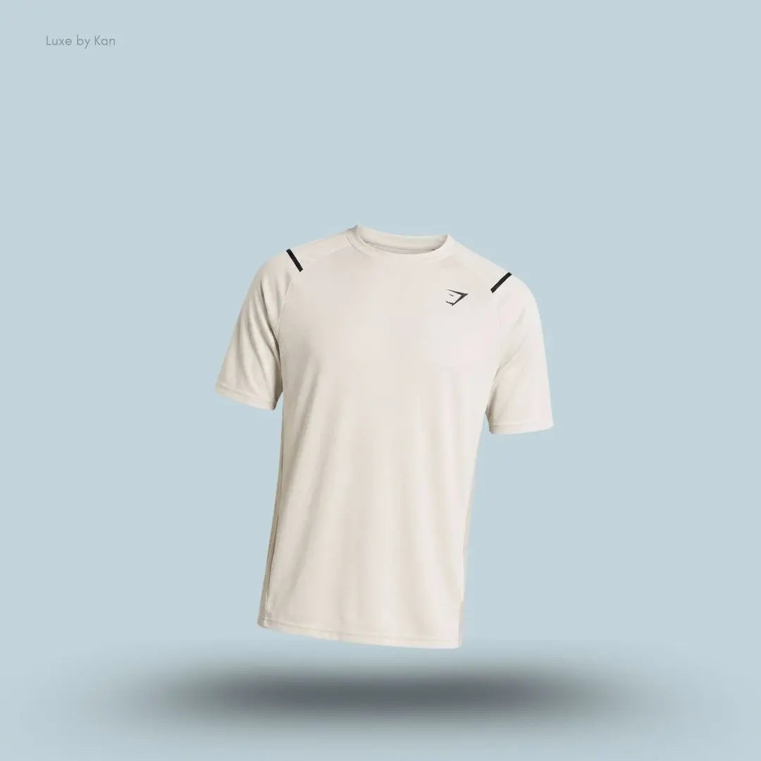 Gymshark Arrival Contrast T-Shirt in white displayed on a blue background with contrast shoulder piping and short sleeves