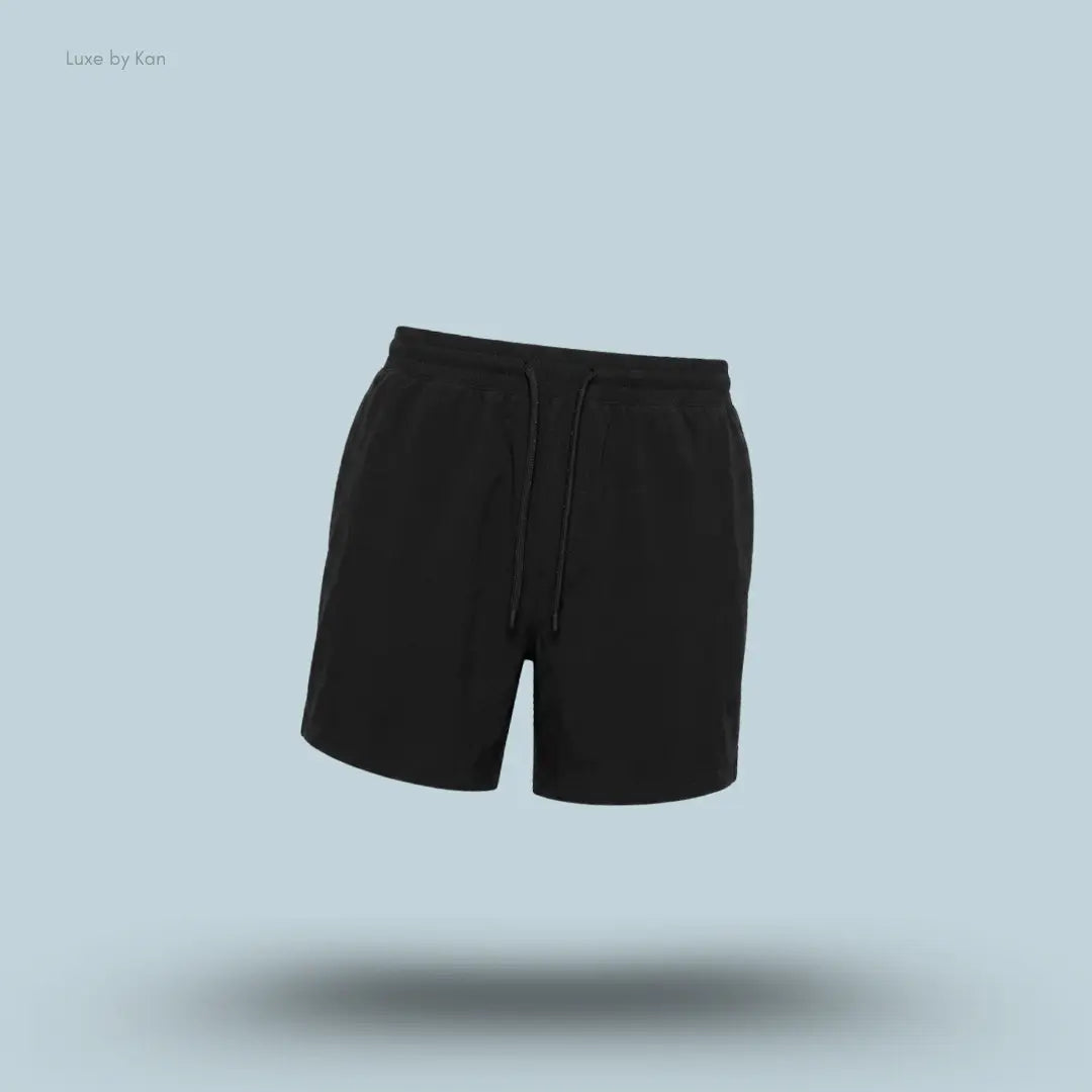 Lululemon Swim Short 5" Lined in Black, flat lay on light blue background