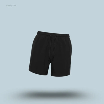 Lululemon Swim Short 5" Lined in Black, flat lay on light blue background