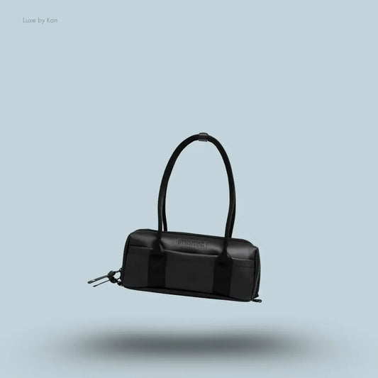 Gymshark Everyday Baguette Bag in black displayed on a blue background with a classic short-handle design