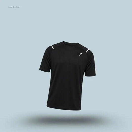 Gymshark Arrival Contrast T-Shirt in black displayed on a blue background with contrast shoulder piping and short sleeves