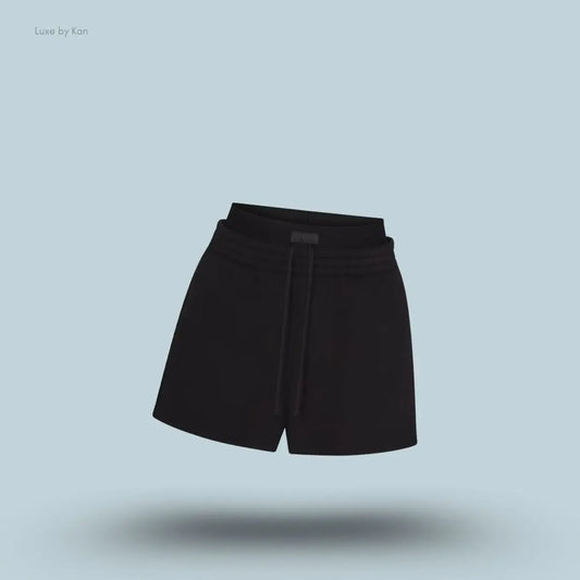 SKIMS Cotton Fleece Double Waistband Short in Onyx, flat lay on light blue background