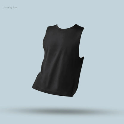 Alo Conquer Muscle Tank in Black, flat lay on light blue background