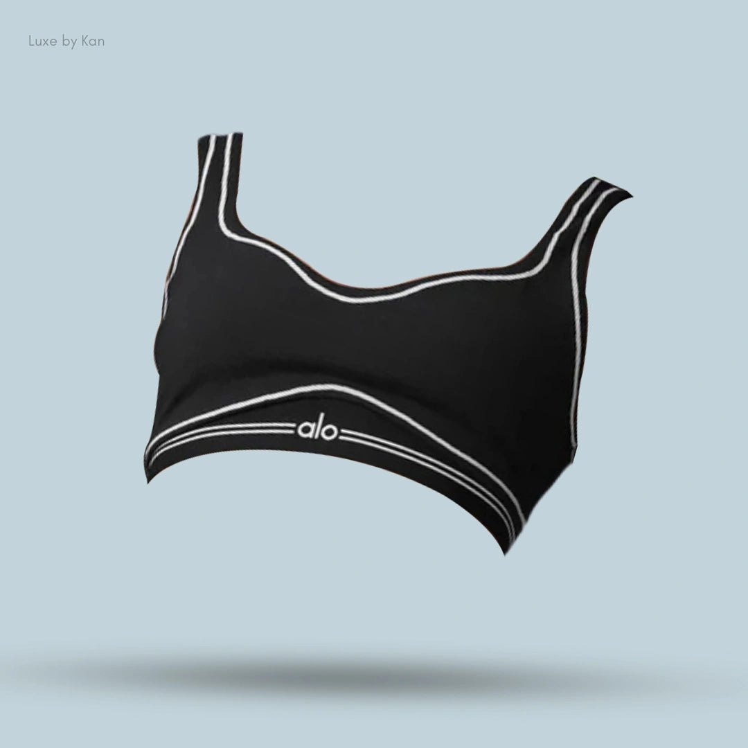 Alo Airbrush Heart Throb Bra in Black/White, flat lay on light blue background