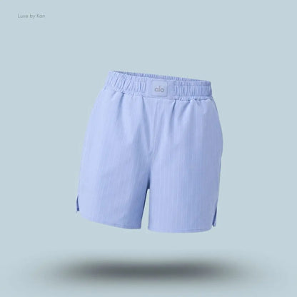 Alo Pinstripe Daylight Boxer Short in Light Provence Blue/White, flat lay on light blue background