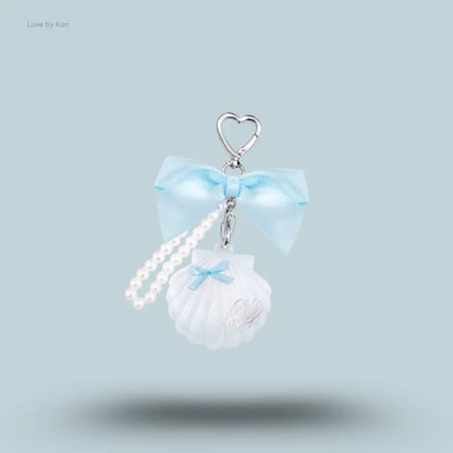 Flower Knows Shell's Jewel Highlighter Balm in Blue Tears, icy sapphire shimmer in seashell charm
