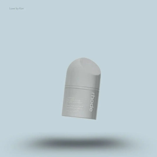 Rhode Peptide Glazing Fluid in an opaque gray container with the brand name in white on the side.