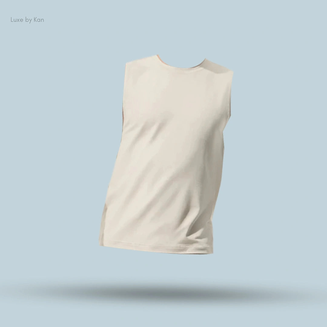 Alo Conquer Muscle Tank in Bone, flat lay on light blue background