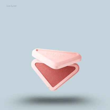 Prada Touch Cream-to-Powder Melting Blush in Bow, flat lay on light blue background