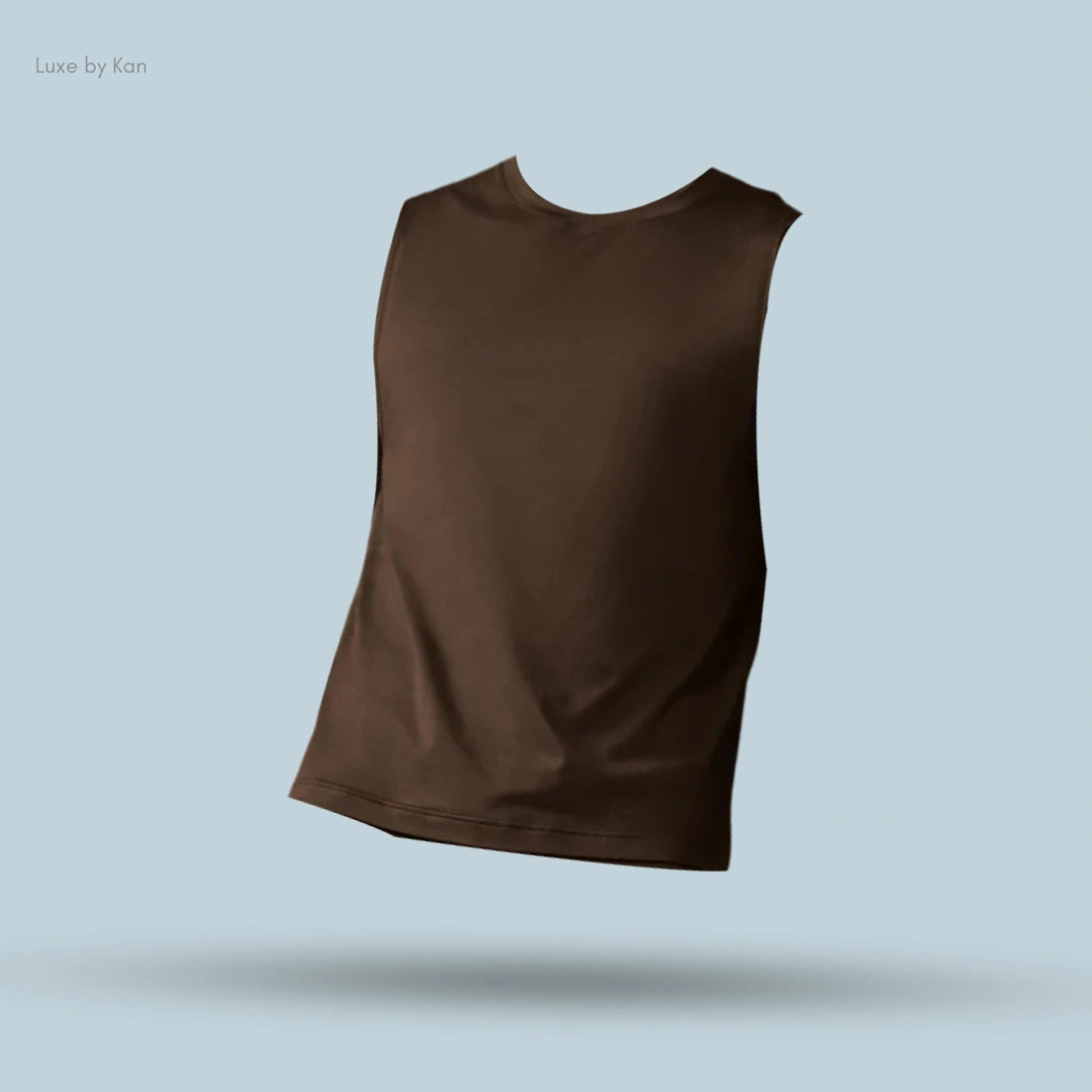 Alo Conquer Muscle Tank in Espresso, flat lay on light blue background